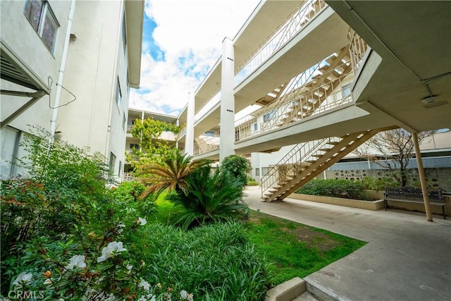 view of home's community featuring stairs