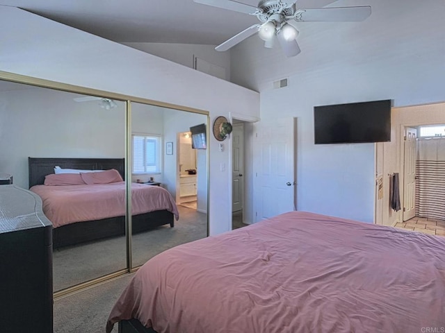 bedroom with ceiling fan, connected bathroom, visible vents, a closet, and carpet