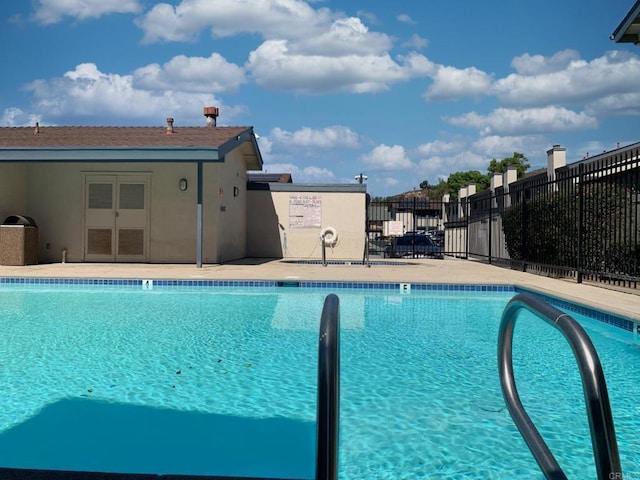 community pool with fence