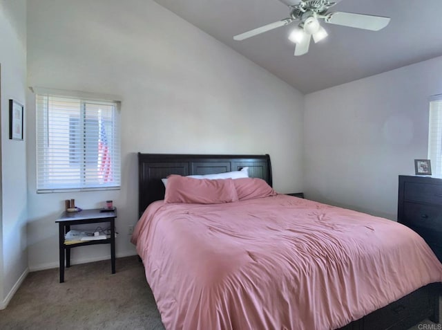 bedroom featuring carpet floors, ceiling fan, baseboards, and vaulted ceiling