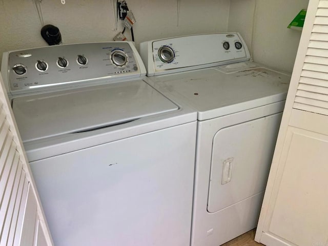 clothes washing area featuring laundry area and washing machine and dryer