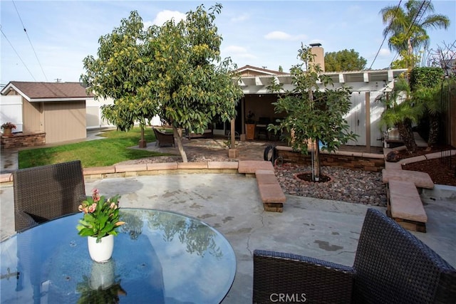 view of patio / terrace with a storage unit