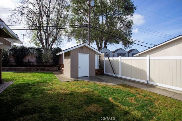 view of shed featuring a fenced backyard