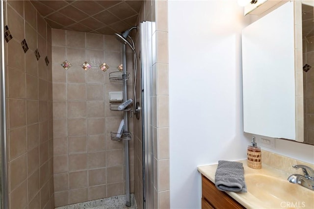 full bath featuring a stall shower and vanity