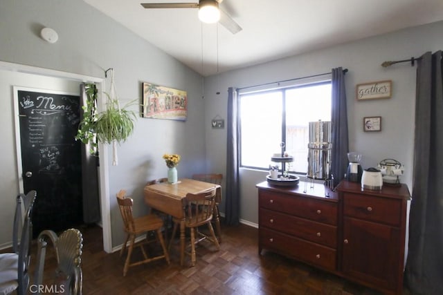 interior space with lofted ceiling, ceiling fan, and baseboards