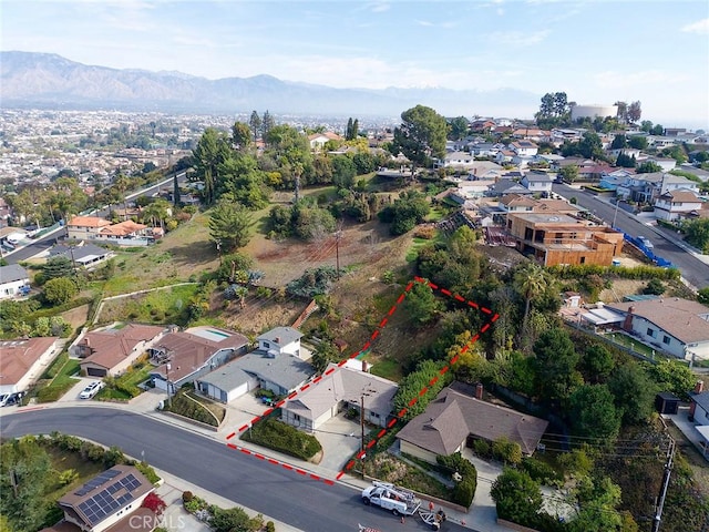 drone / aerial view featuring a residential view and a mountain view