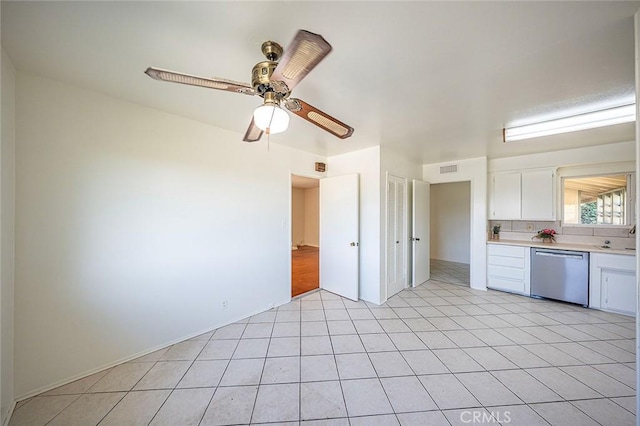 kitchen featuring dishwasher, light countertops, a ceiling fan, and white cabinets