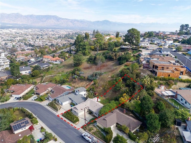 birds eye view of property with a residential view and a mountain view