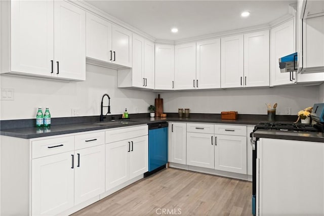 kitchen with a sink, white cabinets, dishwasher, and gas stove