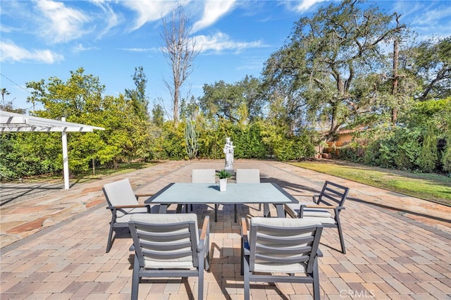 view of patio / terrace with outdoor dining area and a pergola