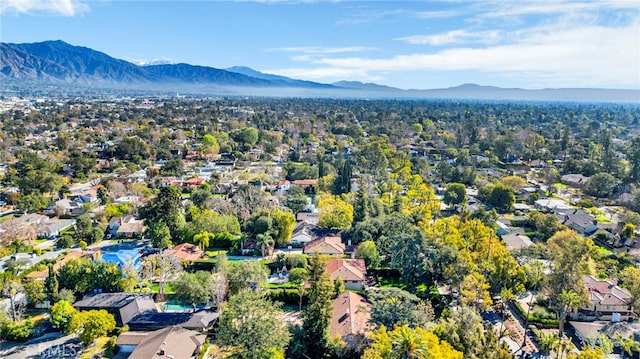 drone / aerial view featuring a residential view and a mountain view