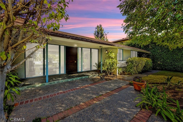 exterior space with a patio area and stucco siding