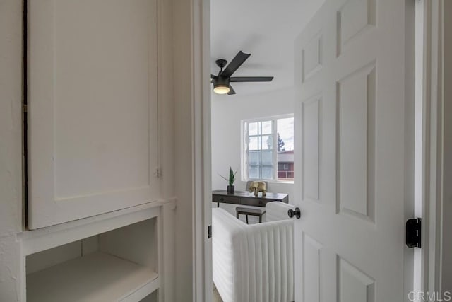 interior details featuring a ceiling fan