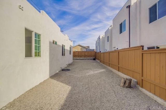 view of yard featuring a patio area and a fenced backyard