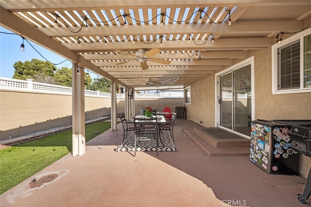 view of patio featuring outdoor dining area, a fenced backyard, a ceiling fan, and a pergola