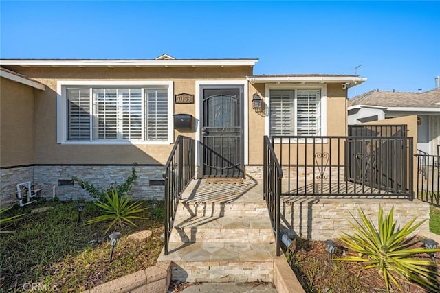 bungalow featuring crawl space, fence, and stucco siding