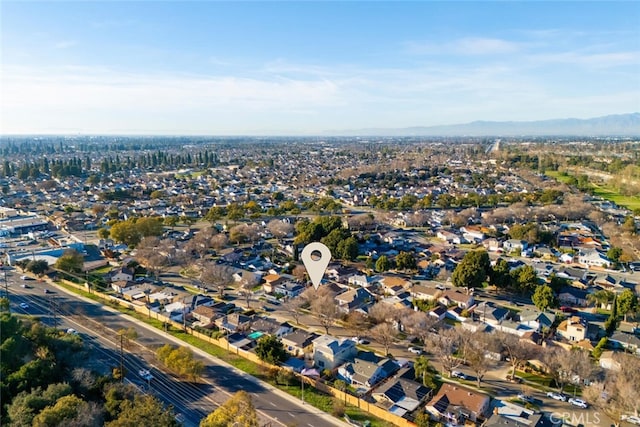 birds eye view of property with a mountain view and a residential view