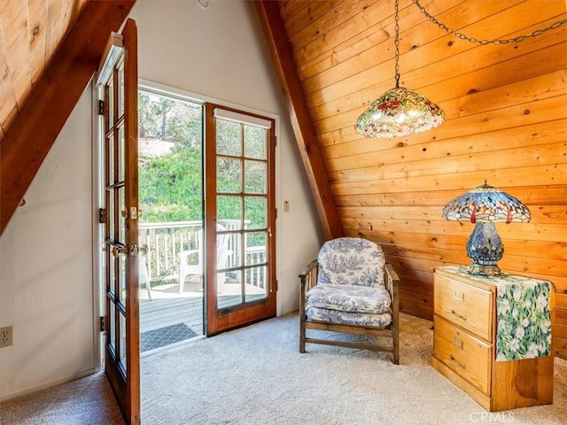 unfurnished room featuring carpet and vaulted ceiling