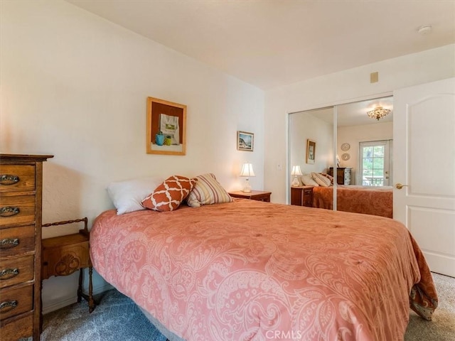 bedroom with carpet floors and a closet