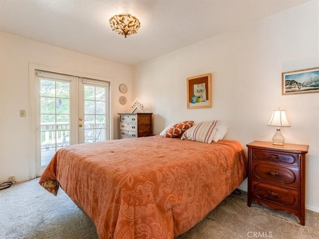 bedroom with carpet floors, access to outside, and french doors