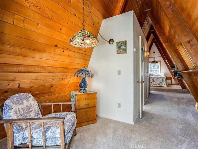 unfurnished room with lofted ceiling, wood ceiling, carpet flooring, and baseboards