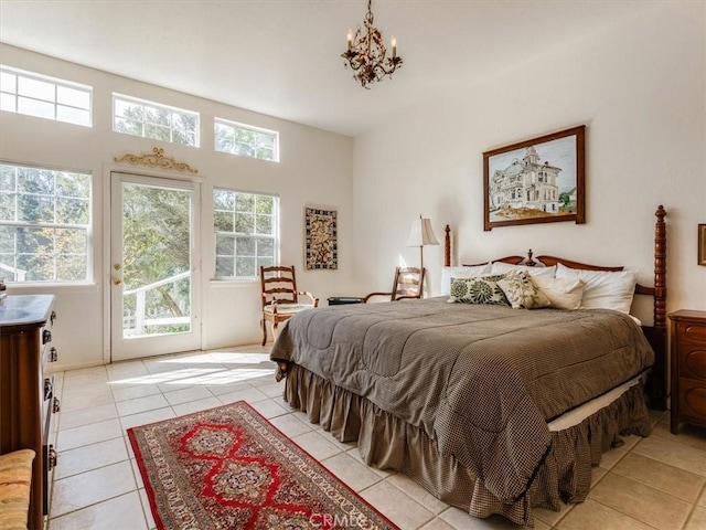 bedroom featuring light tile patterned floors, a notable chandelier, and access to exterior