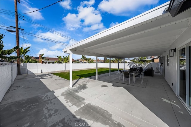 view of patio / terrace with outdoor dining space and a fenced backyard