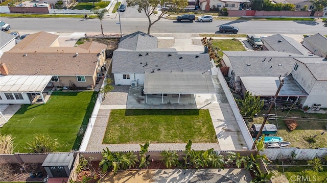 birds eye view of property with a residential view