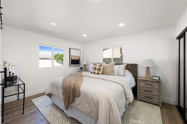 bedroom featuring recessed lighting, baseboards, and wood finished floors