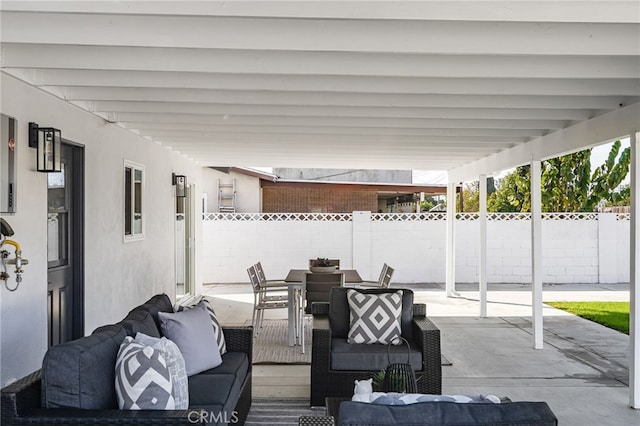 view of patio with an outdoor hangout area, outdoor dining area, and fence