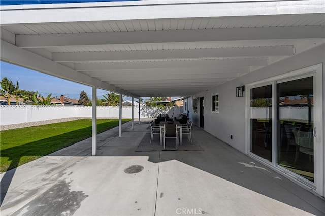 view of patio with outdoor dining area and a fenced backyard