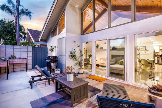 view of patio featuring fence