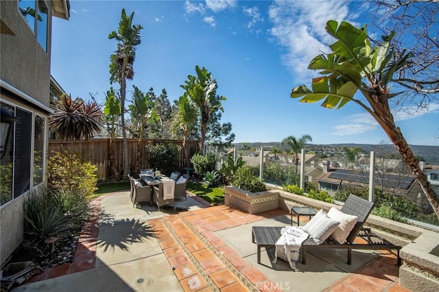 view of patio / terrace with outdoor dining space and a fenced backyard