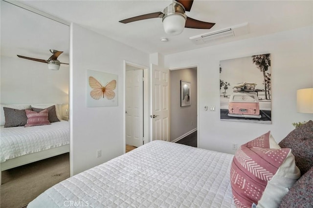 carpeted bedroom with visible vents and a ceiling fan