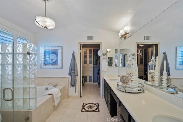 full bathroom with lofted ceiling, visible vents, a bath, and tile patterned floors