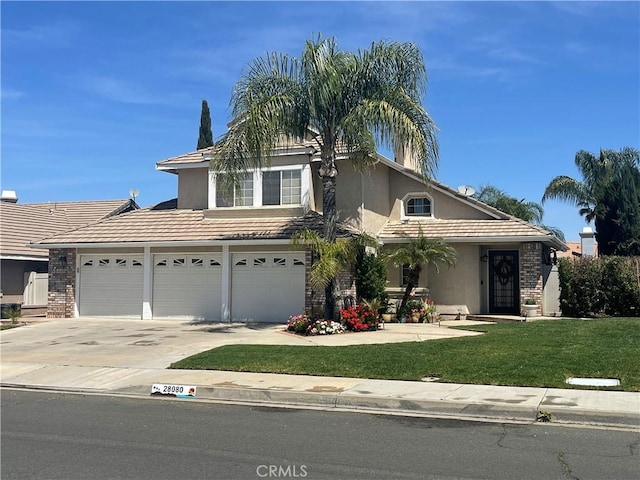 view of front of property with a front yard, a tile roof, driveway, and stucco siding