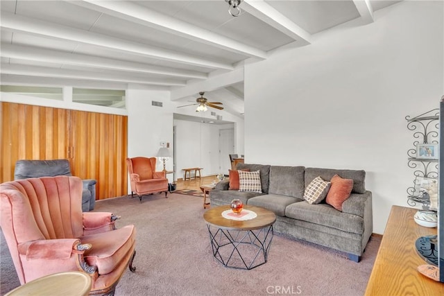 living area featuring vaulted ceiling with beams, ceiling fan, carpet flooring, and visible vents