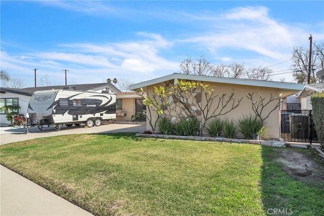 view of front of property with a front lawn and stucco siding