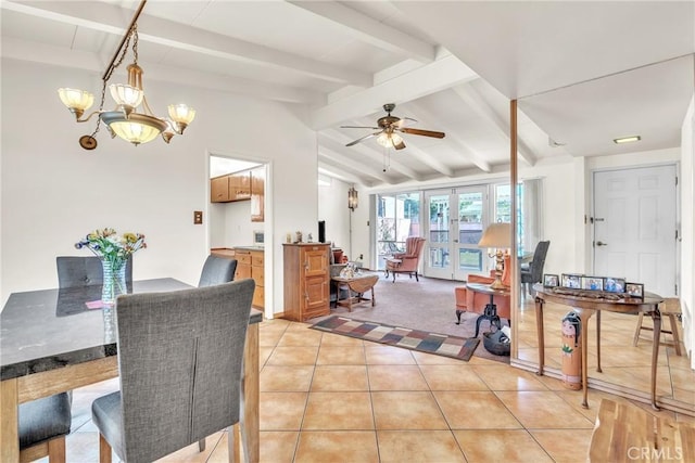 dining room featuring vaulted ceiling with beams, light tile patterned floors, ceiling fan with notable chandelier, and french doors