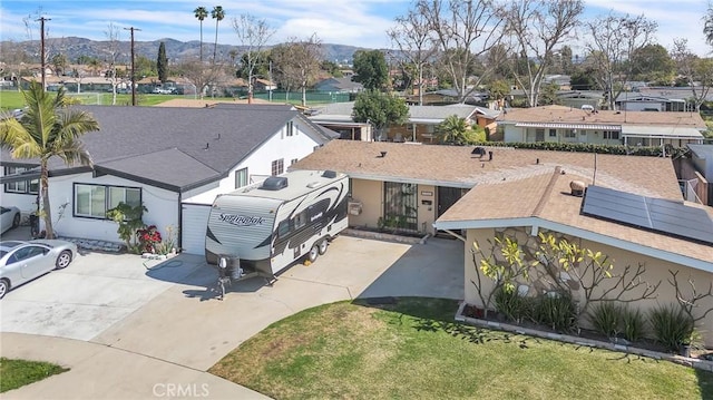 birds eye view of property with a residential view and a mountain view