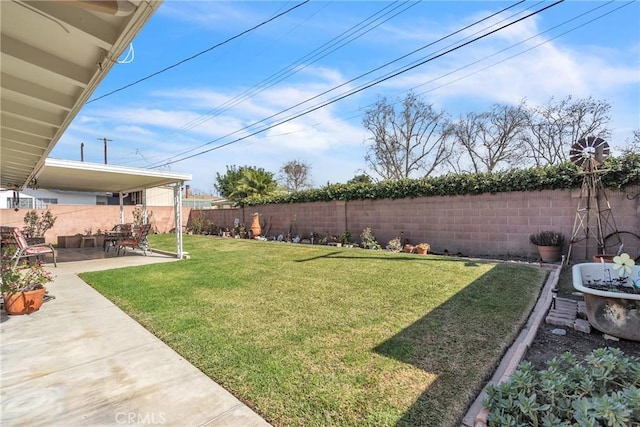 view of yard featuring a patio area and a fenced backyard