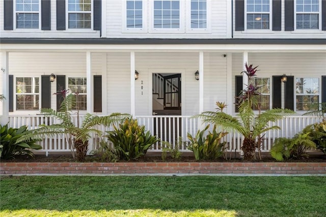 entrance to property with a yard