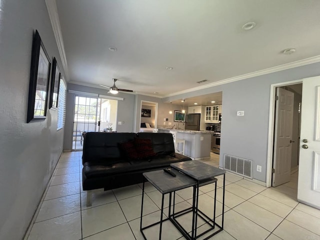 750 Eastshore Ter Unit 120, Chula Vista, CA 91913 - living area featuring crown molding, light tile patterned floors, a ceiling fan, and baseboards