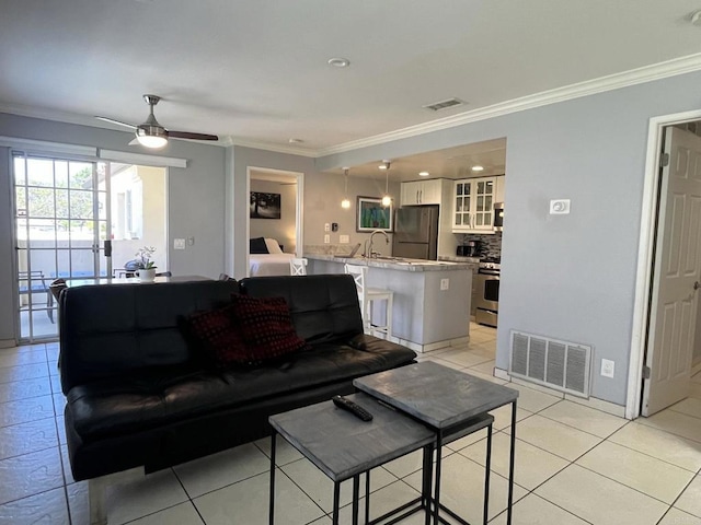 750 Eastshore Ter Unit 120, Chula Vista, CA 91913 - living area featuring crown molding, ceiling fan, and light tile patterned floors