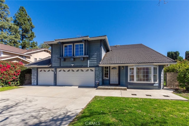 traditional-style home featuring a garage, stone siding, a front lawn, and driveway