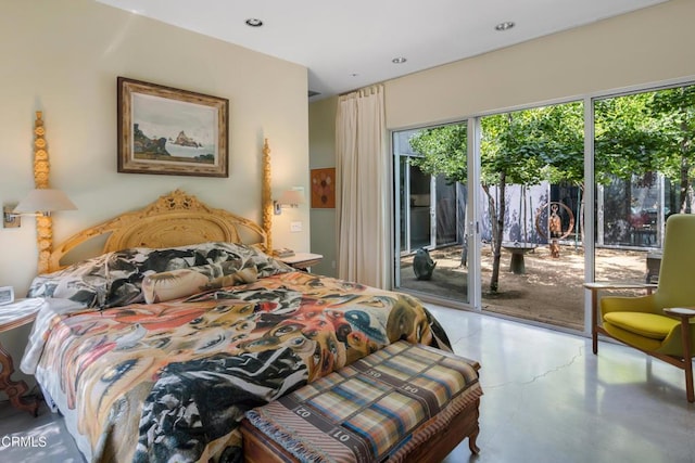 bedroom featuring access to outside, concrete floors, and recessed lighting