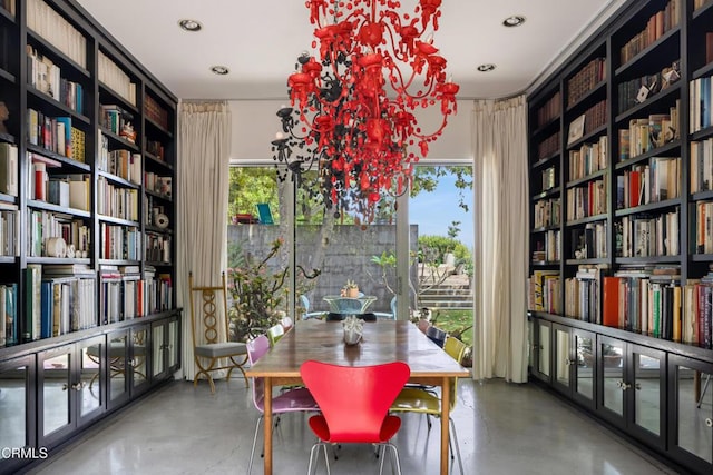 dining space with a chandelier, recessed lighting, and finished concrete floors