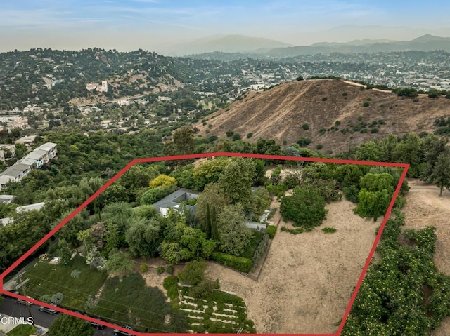 birds eye view of property featuring a mountain view