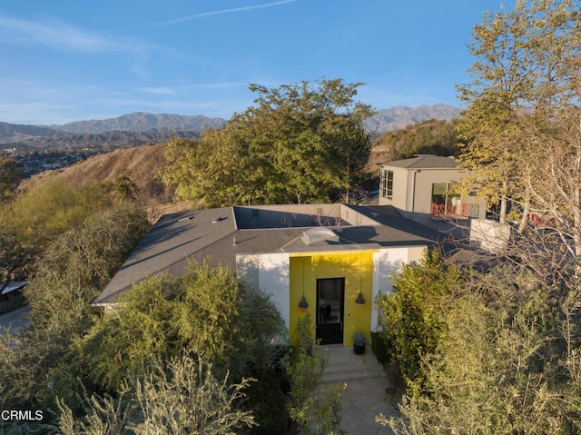 view of front of property with a mountain view and stucco siding