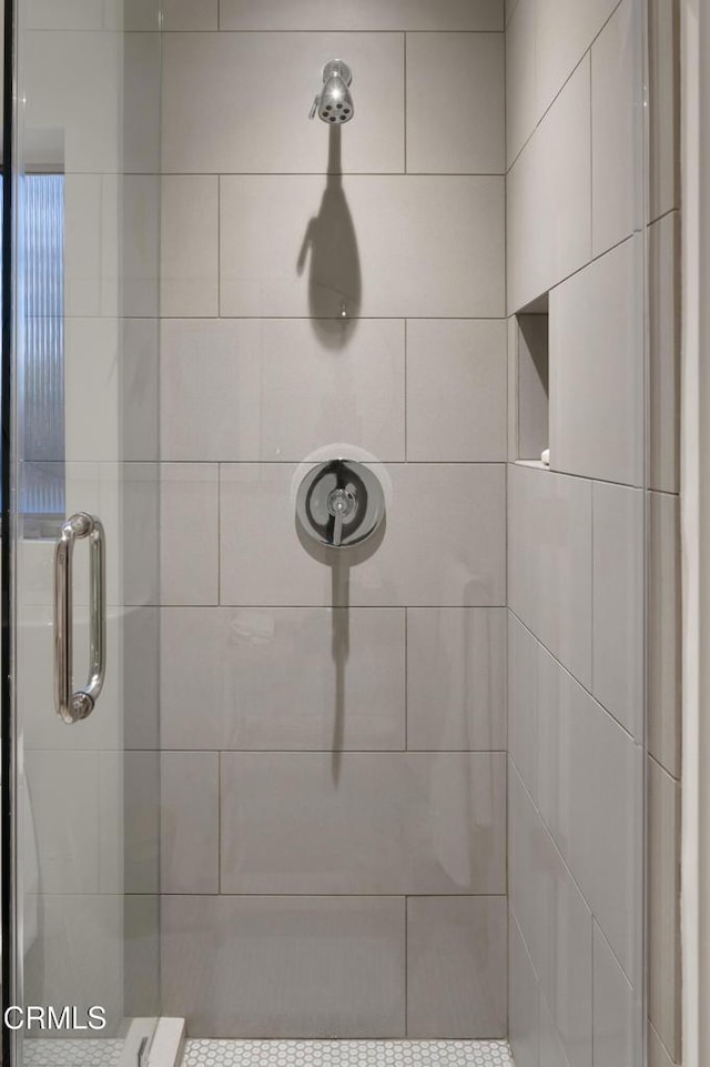 bathroom with a shower stall